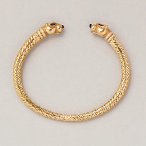 Vintage Cartier Panthere Gold Bangle Bracelet, 18ct yellow gold bangle bracelet with a panther head at both ends with sapphire eyes, onyx noses and diamond-set collars