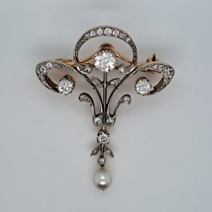 Art Nouveau 1.60ct Old Cut Diamond and Pearl Pendant come Brooch in platinum upon yellow gold. Circa 1870