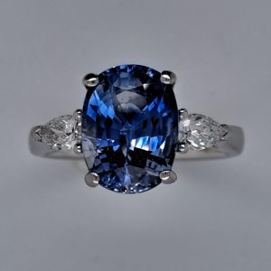 4.80ct Oval Sri Lanka Sapphire and Pear Cut Diamond Trilogy Three Stone Engagement Ring in platinum