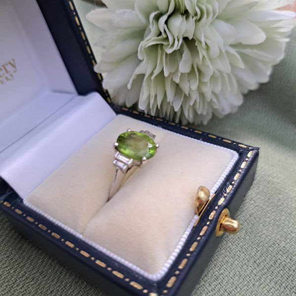 Oval Peridot and Baguette Diamond Engagement Ring in 18ct White Gold