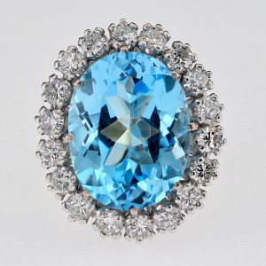 Vintage French 12ct Blue Topaz and Diamond Cluster Ring, 12cts vibrant intense sky blue topaz surrounded by 1.50cts of sparkling round brilliant-cut diamonds in platinum upon 18ct white gold, Circa 1950