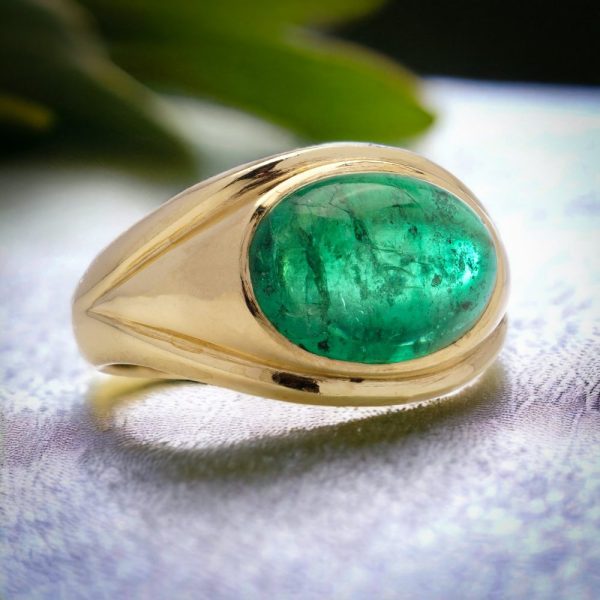 Vintage emerald dome ring set in gold.