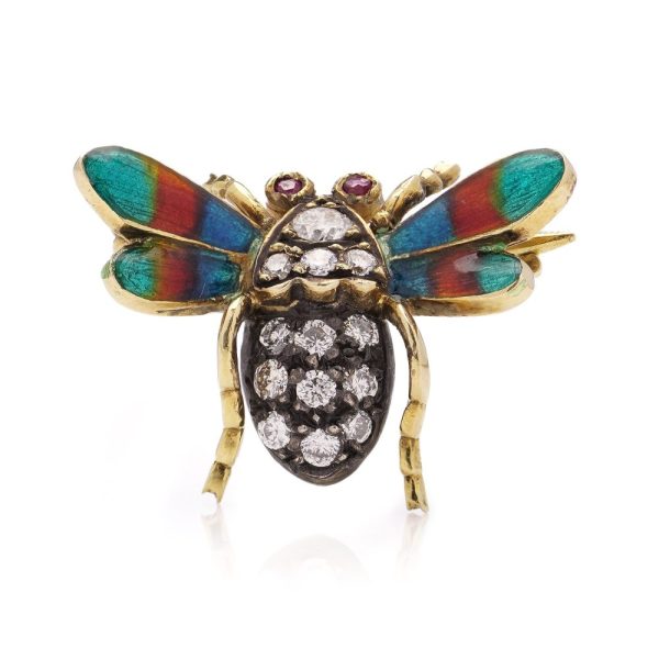 Antique insect brooch in gold and silver set with diamonds enamel and rubies. 