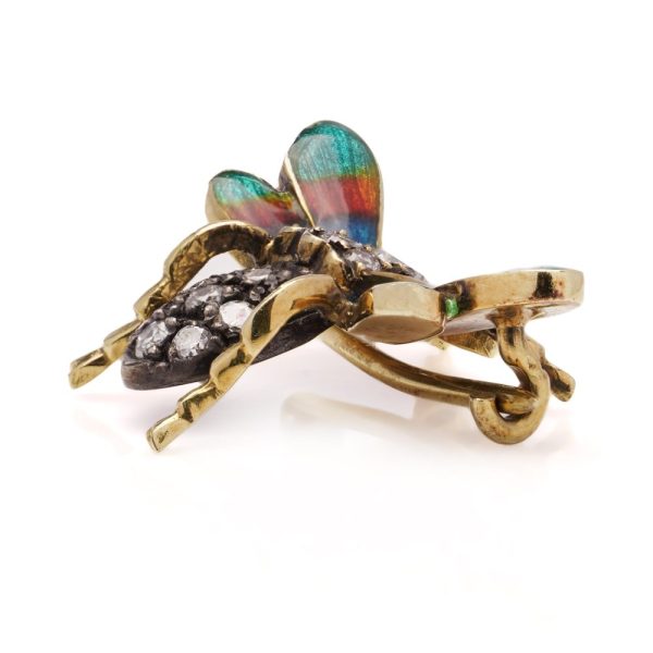 Antique insect brooch in gold and silver set with diamonds enamel and rubies. 