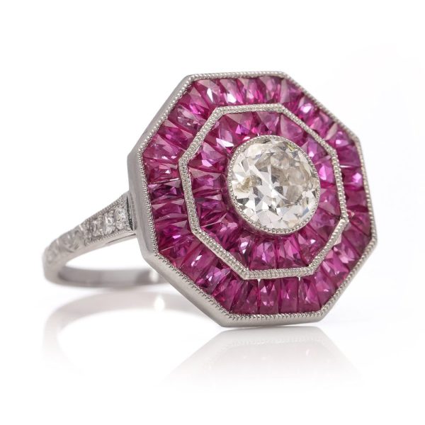 Diamond and ruby target cluster ring set in platinum made by JoAq. 