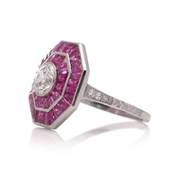Diamond and ruby target cluster ring set in platinum made by JoAq. 