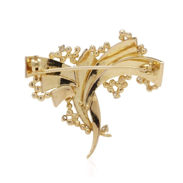 Vintage AMG abstract 18 carat yellow gold and diamond brooch.