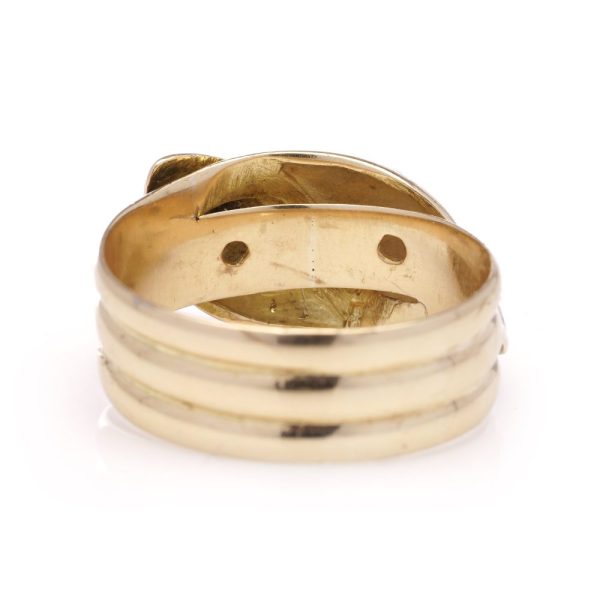 Antique gold men's snake ring set with two diamonds.