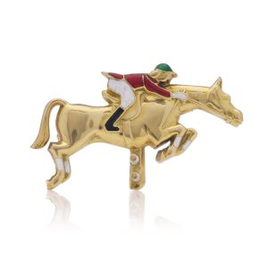 Jockey and horse brooch 18 carat gold and enamel.