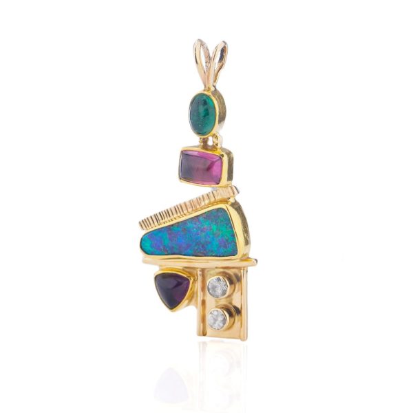 Gold pendant with opal, diamonds, emerald, amethyst, and pink spinel.