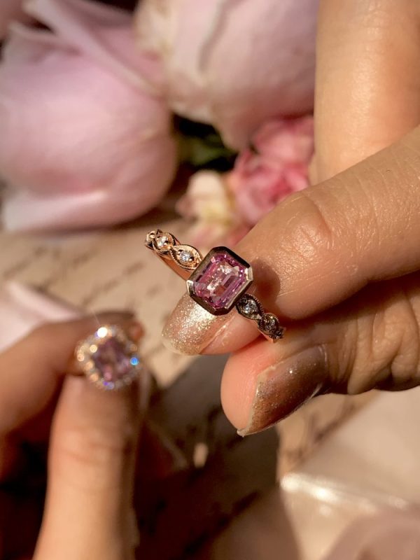 Certified Natural No Heat Pink Sapphire Solitaire Engagement Ring with Diamond Shoulders, single stone 0.99ct emerald-cut pink sapphire flanked by diamond-set shoulders in a twisted marquise pattern in 18ct rose gold