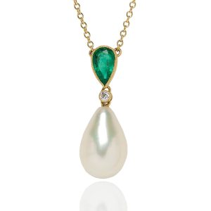 Teardrop freshwater pearl pendant topped with a drop shape emerald and single brilliant cut diamond set in 18 carat yellow gold.