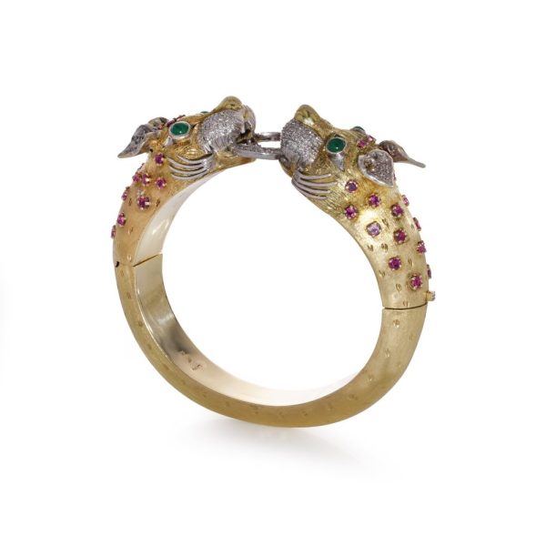 Larry dragon head gold bangle with diamonds, emeralds, and rubies.