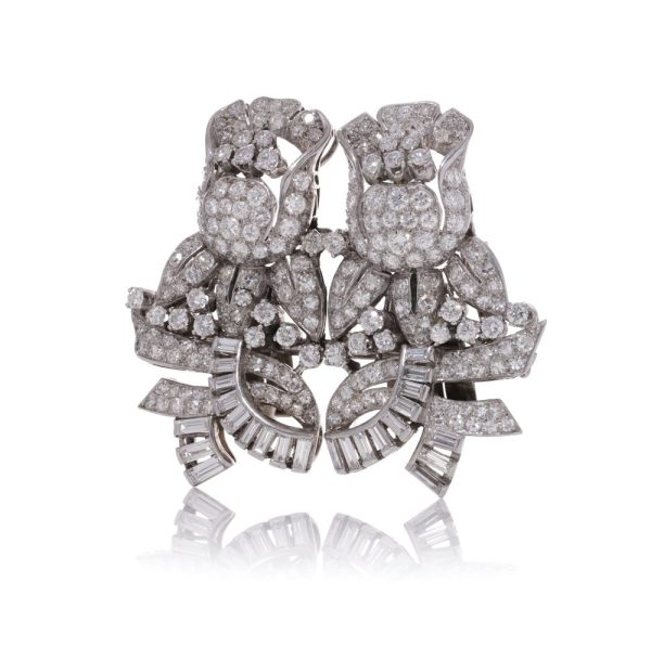Diamond, platinum and gold double-clip/pendant flower-shaped brooch.