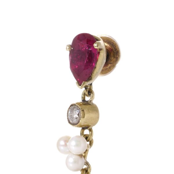 Vintage gold drop earrings set with rubies, diamonds and pearls.