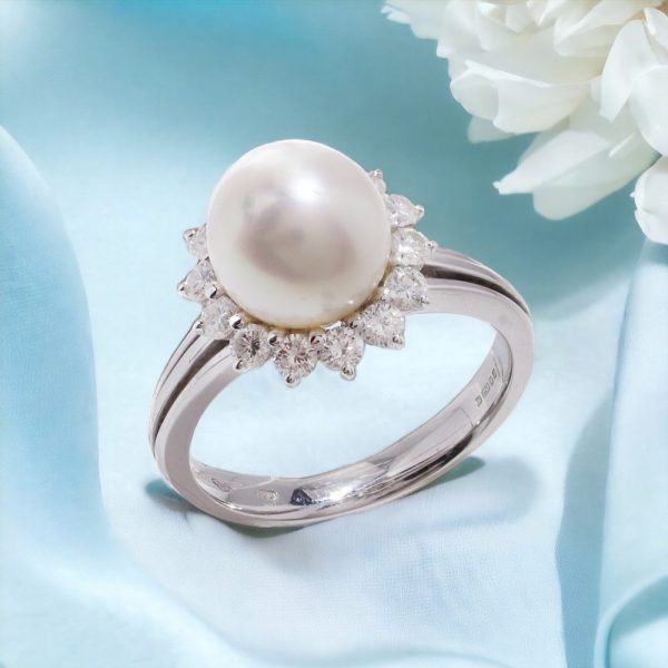 Mappin & Webb pearl and diamond cluster ring in white gold.