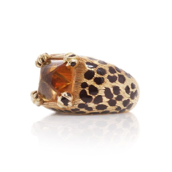 Dior cocktail ring with a sugarloaf cabochon-cut citrine, held by paw prongs in gold with black enamel leopard spots.