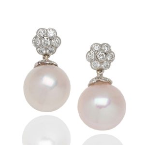 Diamond topped pearl drop earrings in 18 carat white gold.