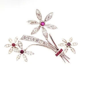 Diamond and ruby brooch and earring suite in white gold.