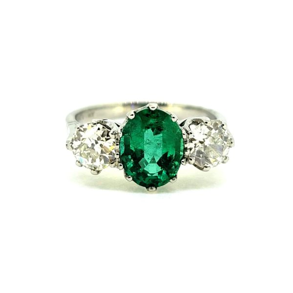 2ct Oval Emerald and Diamond Three Stone Engagement Ring in Platinum