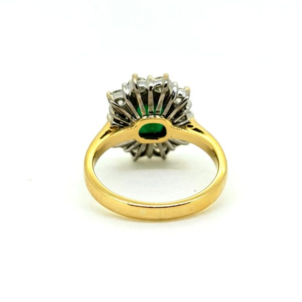 0.50ct Emerald Cut Emerald and 1ct Diamond Floral Cluster Ring