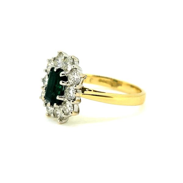 0.50ct Emerald Cut Emerald and 1ct Diamond Floral Cluster Ring