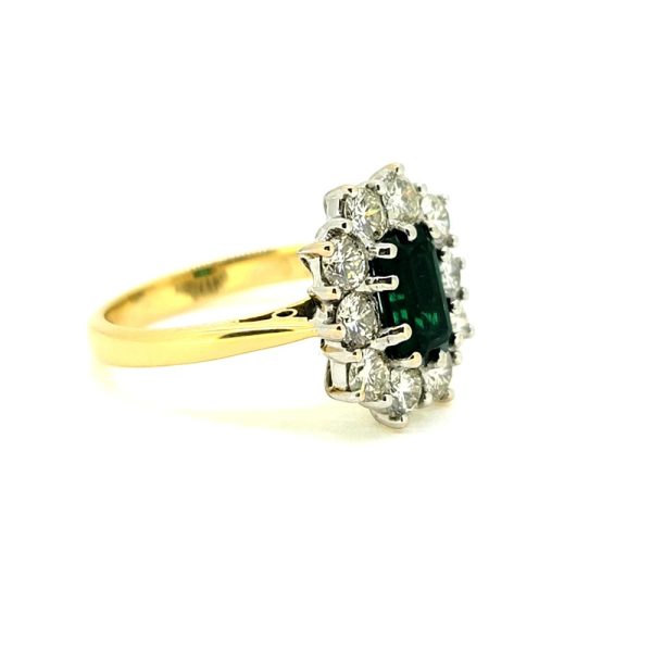 0.50ct Emerald Cut Emerald and 1ct Diamond Floral Cluster Ring