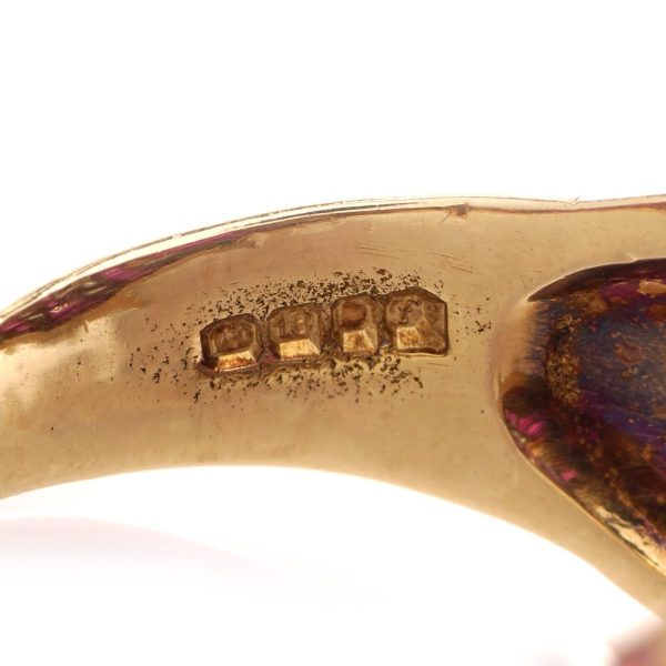 Vintage gold dome ring set with diamonds and rubies.