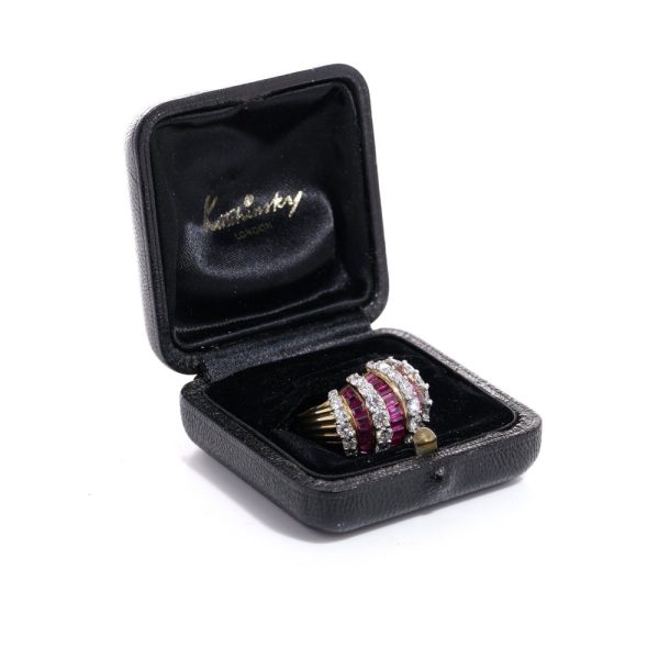 Vintage gold dome ring set with diamonds and rubies.