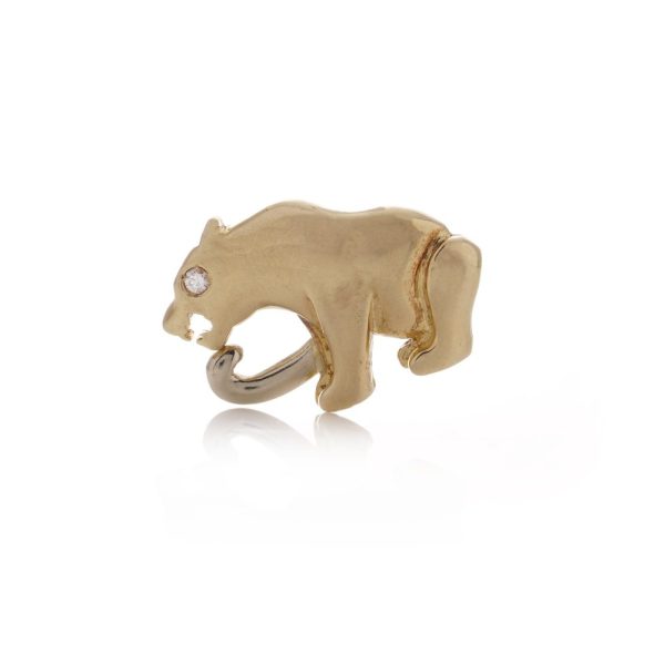 Sitting panther brooch with diamond eye in gold. 