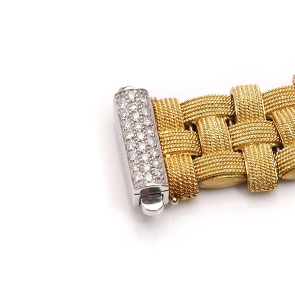 Woven design bracelet in white and yellow gold with diamonds and ruby,