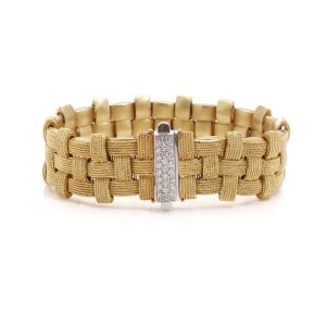 Woven design bracelet in white and yellow gold with diamonds and ruby,