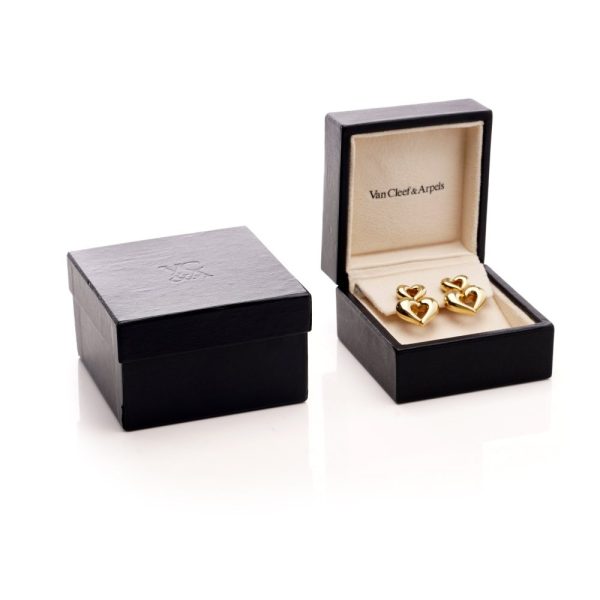 Van Cleef & Arpels clip-on earrings in gold with a heart-shaped design.