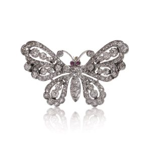Antique white gold and silver butterfly brooch with diamonds and rubies.