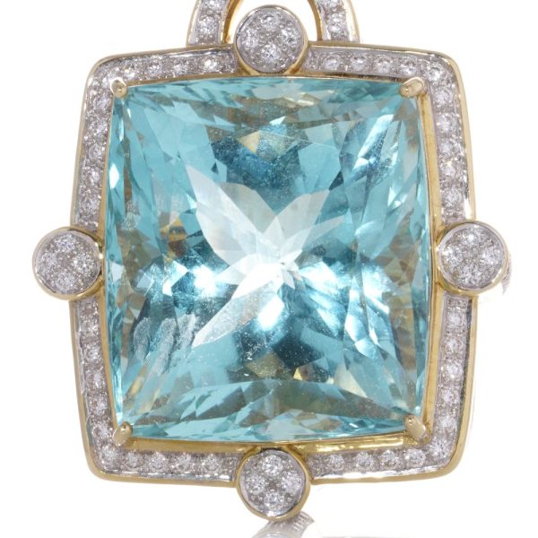 Gold pendant with aquamarine and diamonds.