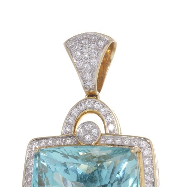 Gold pendant with aquamarine and diamonds.
