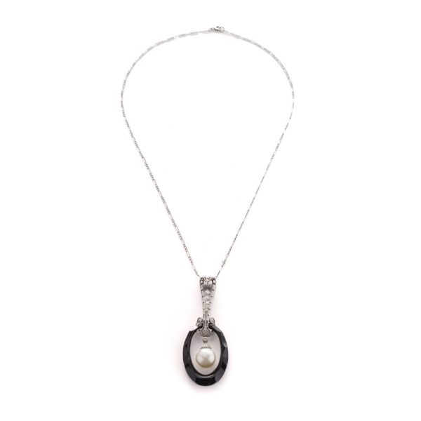 Antique platinum pendant necklace with pearl, onyx, and diamonds.