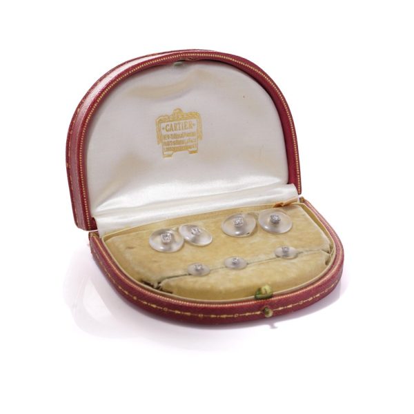 Cartier cufflinks and shirt studs in gold and platinum with rock crystals and diamonds.