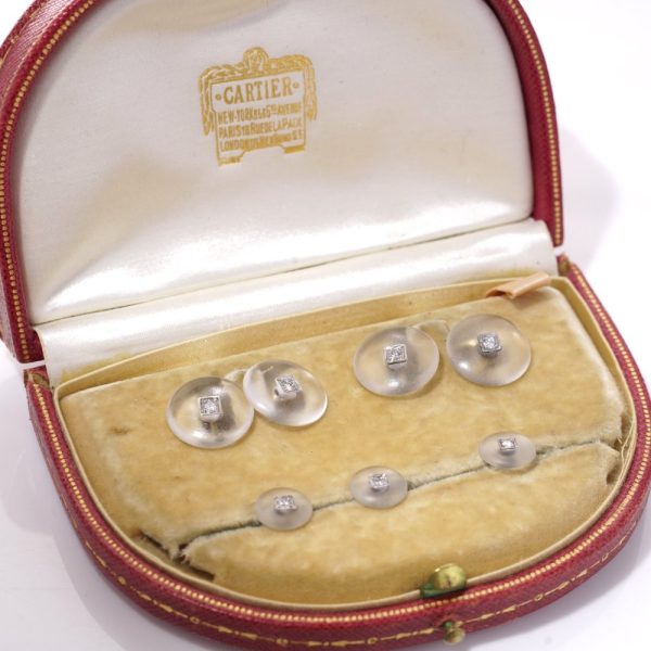 Cartier cufflinks and shirt studs in gold and platinum with rock crystals and diamonds.