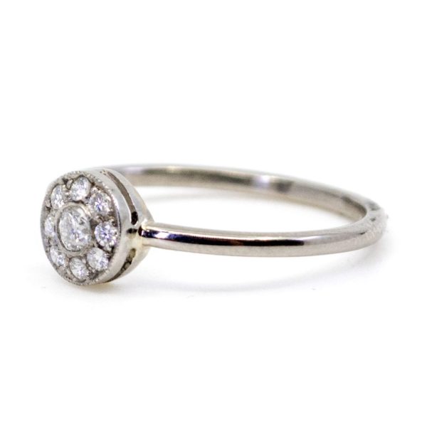 Vintage diamond cluster ring in white gold.