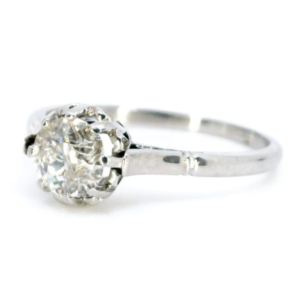 Vintage old mine cut diamond engagement ring in platinum.