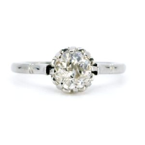 Vintage old mine cut diamond engagement ring in platinum.