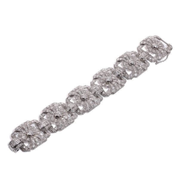 Platinum and diamond floral design link bracelet.
