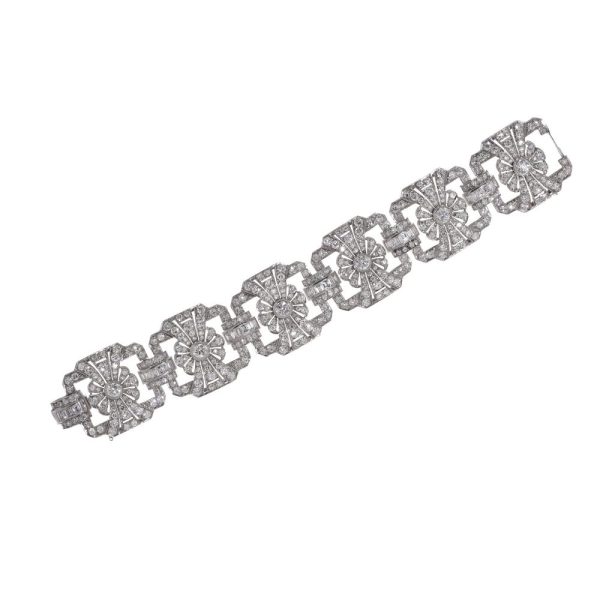 Platinum and diamond floral design link bracelet.