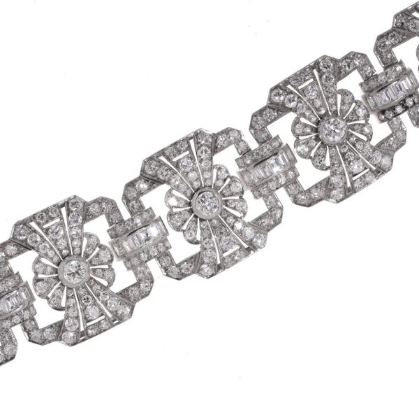 Platinum and diamond floral design link bracelet.