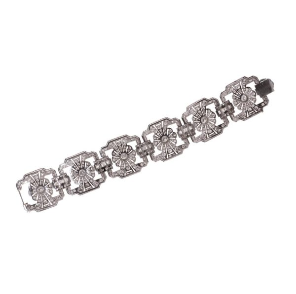 Platinum and diamond floral design link bracelet.