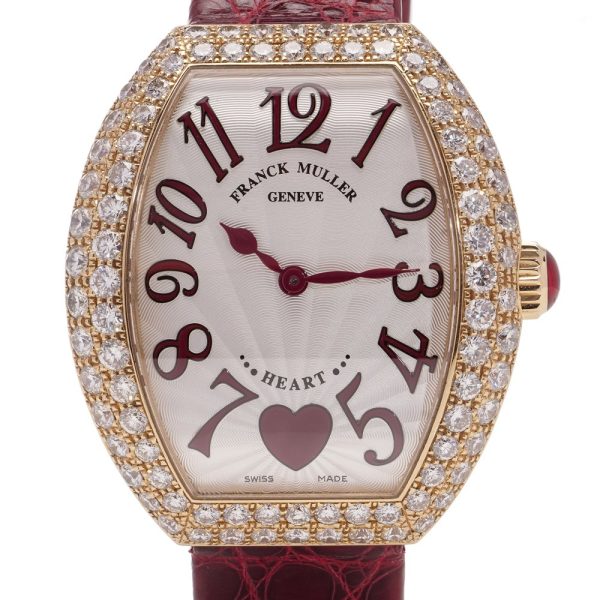 Ladies quartz wristwatch in rose gold with diamond set bezel.