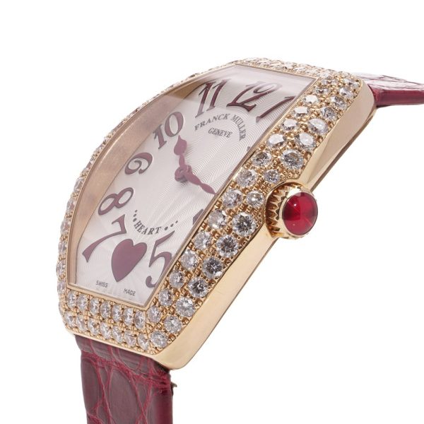 Ladies quartz wristwatch in rose gold with diamond set bezel.
