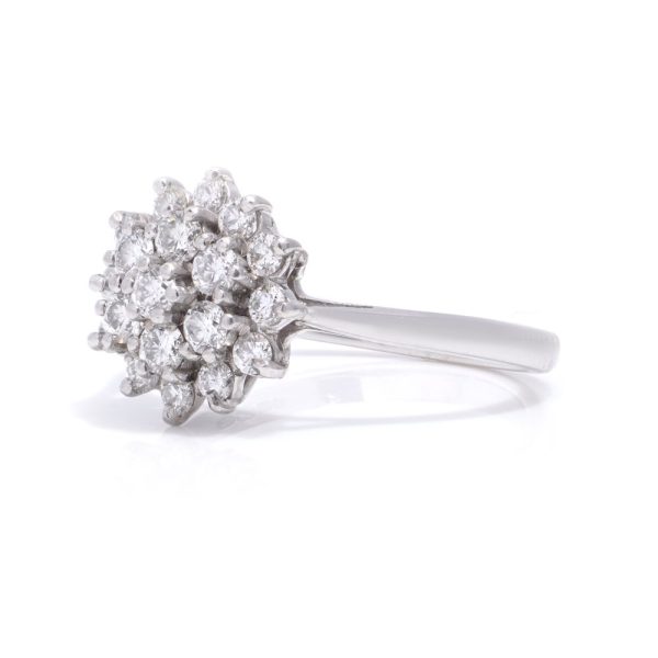 Vintage white gold flower head diamond cluster ring.