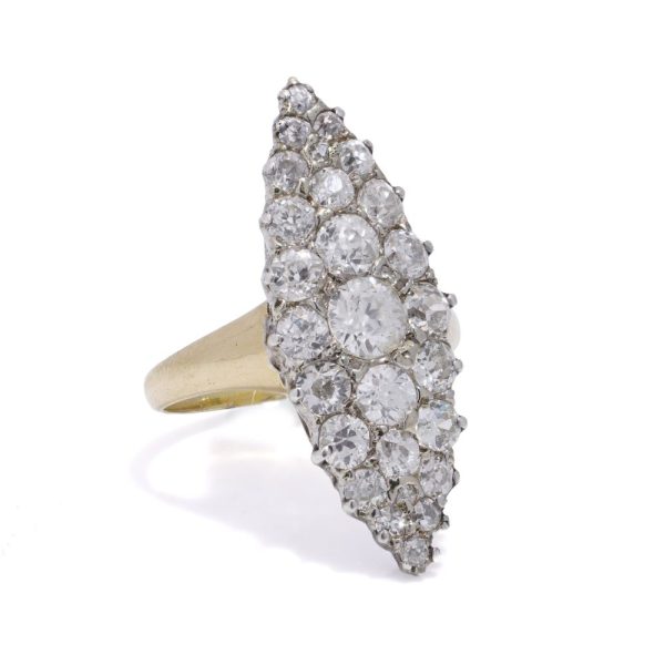 Antique diamond cluster ring in gold and silver.